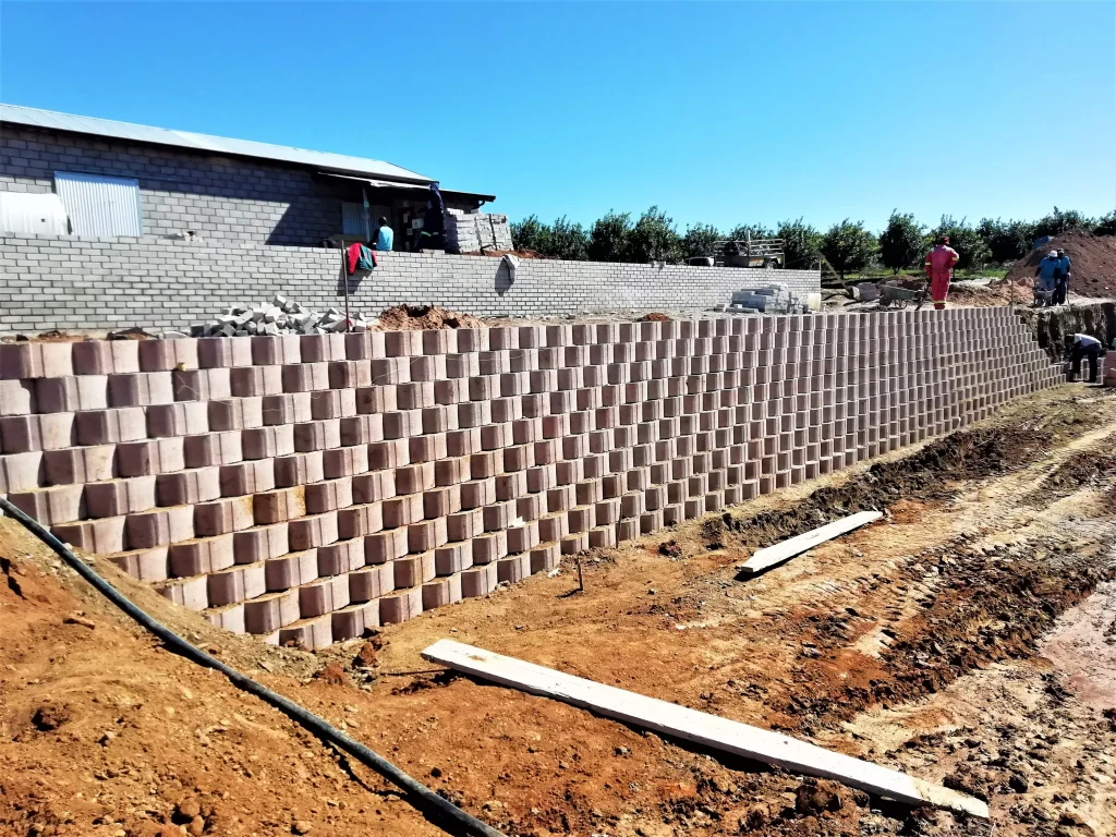 Steel works, concrete works, and retaining wall blocks for soil stabilization