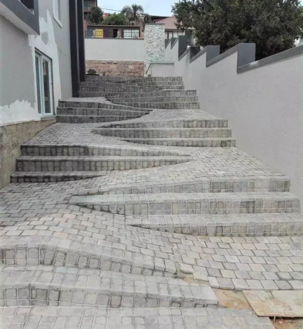 Outdoor staircase construction and paving